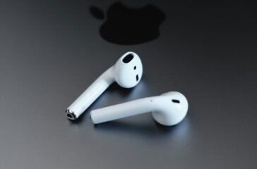 Apple EarPods on gray surface